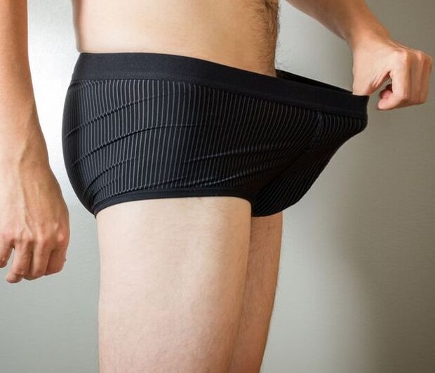 A man checks his underwear after penis enlargement surgery